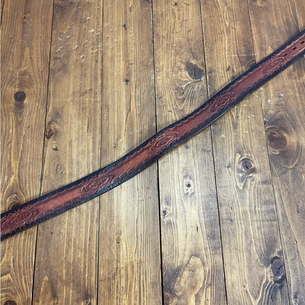 Brown leather belt with embossed design
